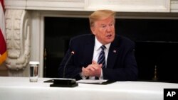 President Donald Trump speaks during a meeting with Republican lawmakers, in the State Dining Room of the White House, Friday, May 8, 2020, in Washington. (AP Photo/Evan Vucci)