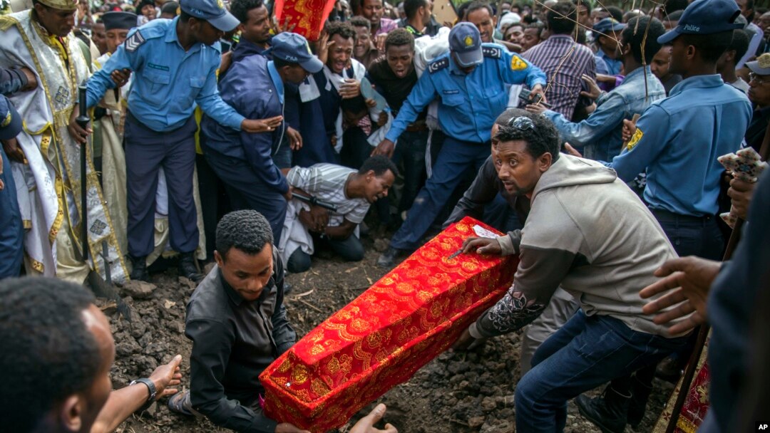 The coffin of one of those killed in the collapse of a mountain of trash at a garbage dump arrives for burial at the Gebrekristos church in Addis Ababa, Ethiopia, March 13, 2017.