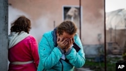 A woman cries after her home was destroyed in a Russian missile strike in Ukraine's Odesa region, Nov. 17, 2024. (Ukrainian Emergency Service via AP)