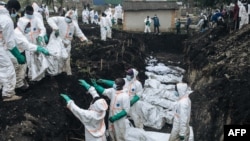 Members of the Congolese Red Cross and Civil Protection bury dozens of victims of the recent clashes in a cemetery in Goma on Feb. 4, 2025.