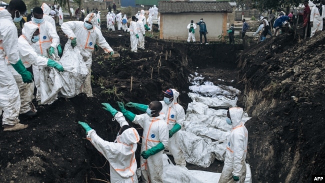 Members of the Congolese Red Cross and Civil Protection bury dozens of victims of the recent clashes in a cemetery in Goma on Feb. 4, 2025.