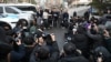 South Korea's main opposition Democratic Party lawmaker Jung Chung-rae, center, speaks to reporters as opposition lawmakers arrive at the Constitutional Court in Seoul on Jan. 14, 2025.