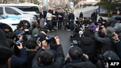 South Korea's main opposition Democratic Party lawmaker Jung Chung-rae, center, speaks to reporters as opposition lawmakers arrive at the Constitutional Court in Seoul on Jan. 14, 2025.