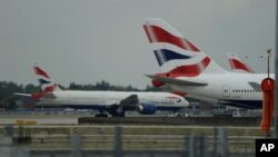 FILE - British Airways planes are seen parked at Heathrow Airport in London, Sept. 9, 2019. 