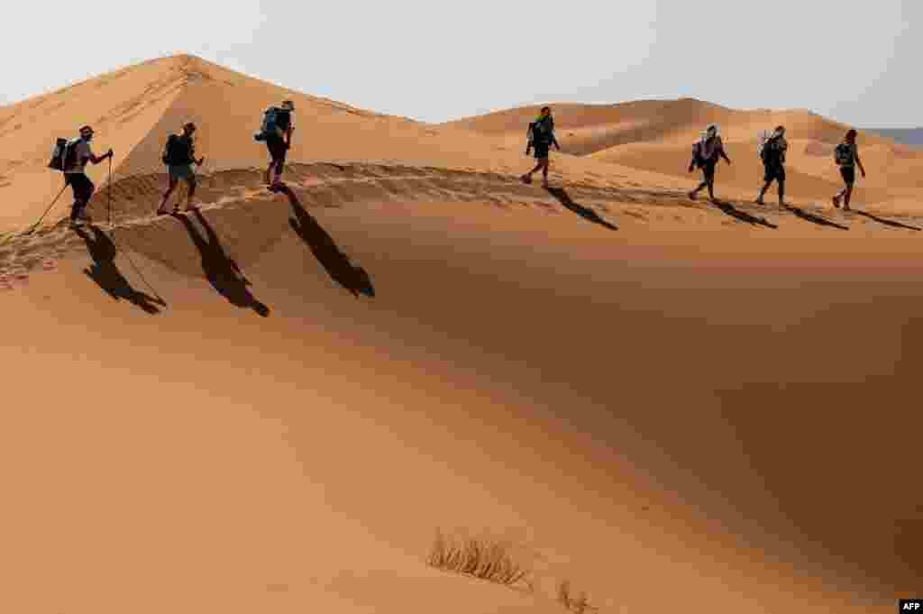 Competitors take part in the stage 3 of the 35th edition of the Marathon des Sables between Kourci Dial Zaid and Jebel El Mraier in the southern Moroccan Sahara desert.