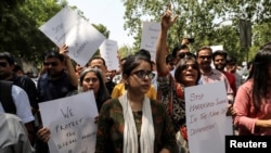 Jagisha Arora, wife of Prashant Kanojia, a journalist who was arrested for allegedly tweeting defamatory content against Uttar Pradesh's Chief Minister Yogi Adityanath, takes part in a protest with media members in New Delhi, India, June 10, 2019. 