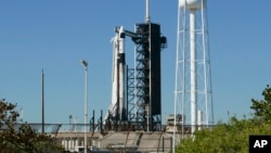 A SpaceX Falcon 9 rocket with the Crew Dragon spacecraft stood ready for a mission to the International Space Station at Kennedy Space Center in Cape Canaveral, Fla., March 12, 2025, but the flight was later scrubbed because of a hydraulic system problem.