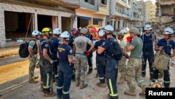 Rescue workers from Malta carry out a search operation for bodies in Derna, Libya, on Sept. 15, 2023, after a powerful storm and flood.