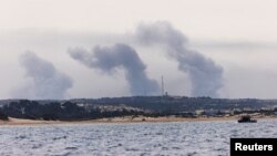 Smoke rises over Gaza, as seen from Israel's maritime border with Gaza in southern Israel October 27, 2023.