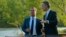 Norwegian Prime Minister Jens Stoltenberg (R) speaks to Russian Prime Minister Dmitry Medvedev in Kirkenes, Norway, June 3, 2013.
