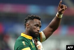 FILE - South Africa's flanker and captain Siya Kolisi reacts after victory in the France 2023 Rugby World Cup quarter-final match between France and South Africa at the Stade de France in Saint-Denis, on the outskirts of Paris, on October 15, 2023.