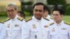 Thailand's Prime Minister Prayuth Chan-ocha, center, arrives for a photo opportunity with members of the new Thai cabinet at Government House in Bangkok, July 16, 2019. 