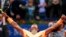 Rafael Nadal merayakan kemenangannya atas Fabio Fognini dari Italia dalam turnamen Barcelona Terbuka (22/4). (AP/Manu Fernandez)