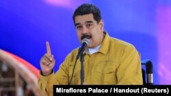 FILE - Venezuela's President Nicolas Maduro speaks during a meeting in a hospital for budget approval for its reconstruction in La Guaira, Venezuela, April 6, 2018.