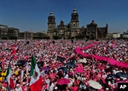 Anti-government demonstrators protest against recent reforms pushed by President Andres Manuel Lopez Obrador to the country's electoral law that they say threaten democracy, in Mexico City's main square, The Zocalo, Feb. 26, 2023.