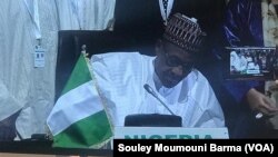 Lokacin da shugaban Najeriya Muhammad Buhari ke sanya hannu a yarjejeniyar AfCFTA