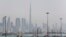 The skyline is seen with the Burj Khalifa as ships dock at Port Rashid, in Dubai, May 26, 2013. 