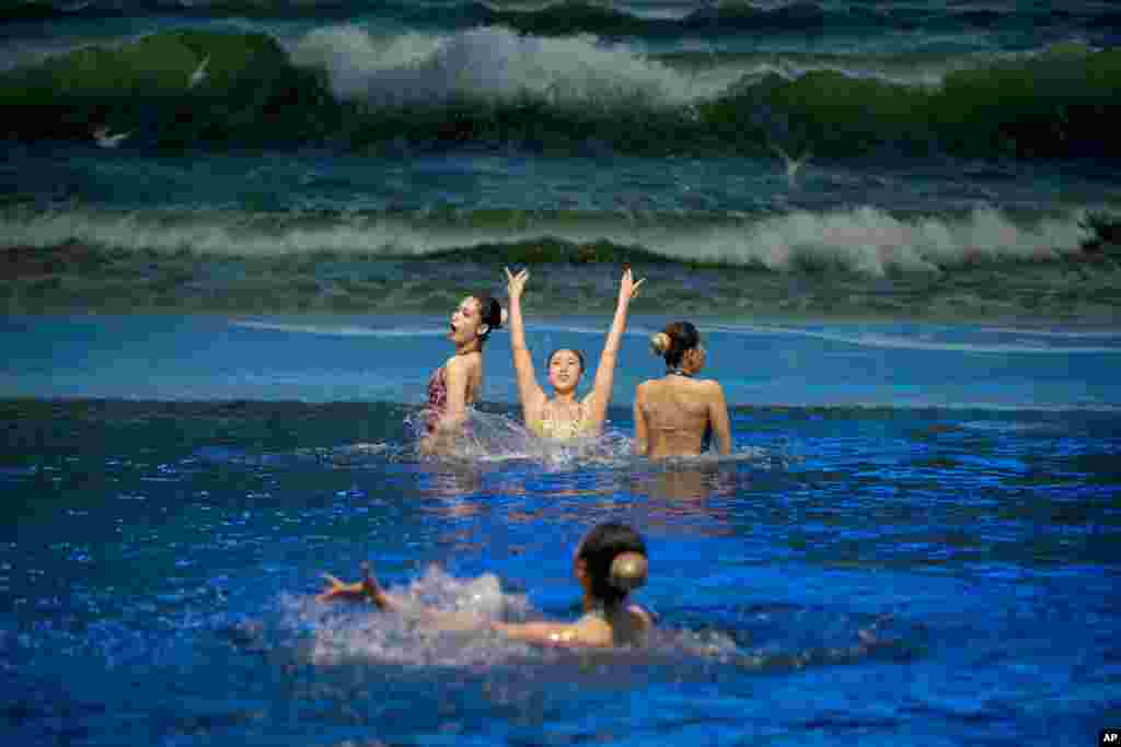 North Korean women perform synchronized swimming at a dolphin show facility in Pyongyang.