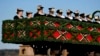 Women in traditional costumes of the region take part at the traditional Leonhardi pilgrimage in Warngau near Munich, Germany, Oct. 27, 2024. The annual pilgrimage honors St. Leonhard, patron saint of the highland farmers for horses and livestock. 