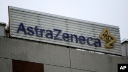 FILE - The AstraZeneca logo is shown on the company's building in Shanghai, China.