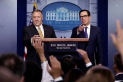 FILE - U.S. Secretary of State Mike Pompeo and Treasury Secretary Steve Mnuchin take questions during a briefing on terrorism financing at the White House, Sept. 10, 2019, in Washington.