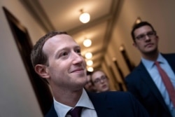 FILE - Facebook CEO Mark Zuckerberg walks to meetings for technology regulations and social media issues on Capitol Hill, in Washington, Sept. 19, 2019.
