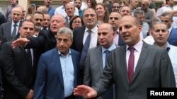 Employees of the Lebanese central bank gather during a strike over state budget proposals that would cut their benefits, in front of the central bank in Beirut, Lebanon, May 6, 2019.