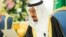 In this photo provided by the Saudi Press Agency, Saudi King Salman delivers his first major policy speech since assuming the throne in the al-Yamama palace, Riyadh, Saudi Arabia, March 10, 2015.