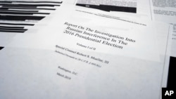 Four pages of special counsel Robert Mueller report on the witness table in the House Intelligence Committee hearing room on Capitol Hill, in Washington, April 18, 2019.