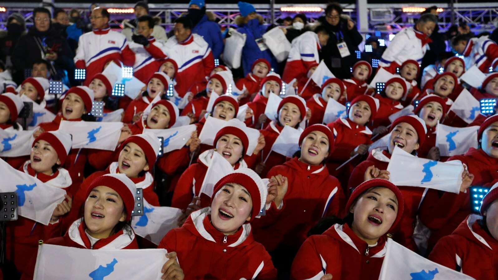 Members of the North Korean delegation hold flags of the combined Koreas before the opening ceremony of the 2018 Winter Olympics in Pyeongchang, South Korea, Feb. 9, 2018.