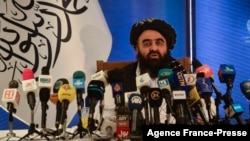 FILE - The Taliban's acting foreign minister, Amir Khan Muttaqi, speaks to the media in Kabul, Afghanistan, Sept. 14, 2021.