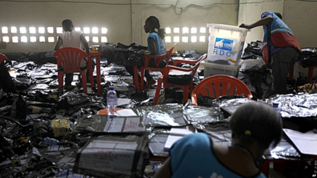 Election volunteers tabulate results at the Fikin compilation center in Kinshasa, Democratic Republic of Congo. Congo's influential clergy say they are concerned about violence and unrest two days before the proclamation of results from a contested presid