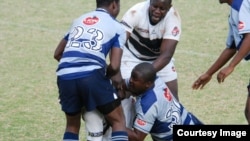 Lucky Sithole, joueur zimbabwéen durant un match 