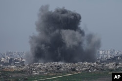 Smoke rises following an Israeli bombardment in the Gaza Strip, as seen from southern Israel, Jan. 19, 2025.