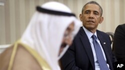 President Barack Obama meets with the emir of Kuwait, Sheik al Ahmad Jaber al-Sabah, in the Oval Office of the White House in Washington, Sept. 13, 2013.