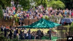 Family, friends and fans attend Gregg Allman's burial at Rose Hill Cemetery, June 3, 2017, in Macon, Ga. 