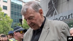 Cardinal George Pell leaves the County Court in Melbourne, Australia, Feb. 26, 2019. The most senior Catholic cleric ever charged with child sex abuse has been convicted of molesting two choirboys.