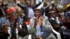 Seated left to right, Kenyans Jane Muthoni Mara, Wambogo Nyingi and Paulo Muoka Nzili celebrate the announcement of a legal decision in support of Mau Mau veteran reparation payments in Nairobi in this October 5, 2012, file photo.