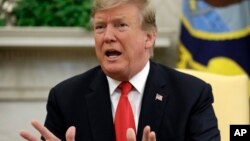 FILE - President Donald Trump speaks in the Oval Office of the White House, April 2, 2019.