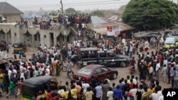 Nigerians continue to celebrate the victory of Presidential candidate Muhammadu Buhari in Kaduna, Nigeria, Wednesday, April 1, 2015. Former military dictator Muhammadu Buhari said Wednesday it was time "to heal wounds," a day after Nigeria's president con