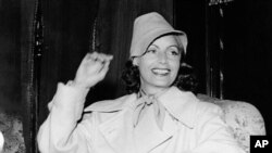 FILE - In this July 17, 1946, file photo, Greta Garbo smiles on her arrival in Gothenburg, Sweden. The New York Times reports that her Manhattan co-op is on the market for $5.95 million.