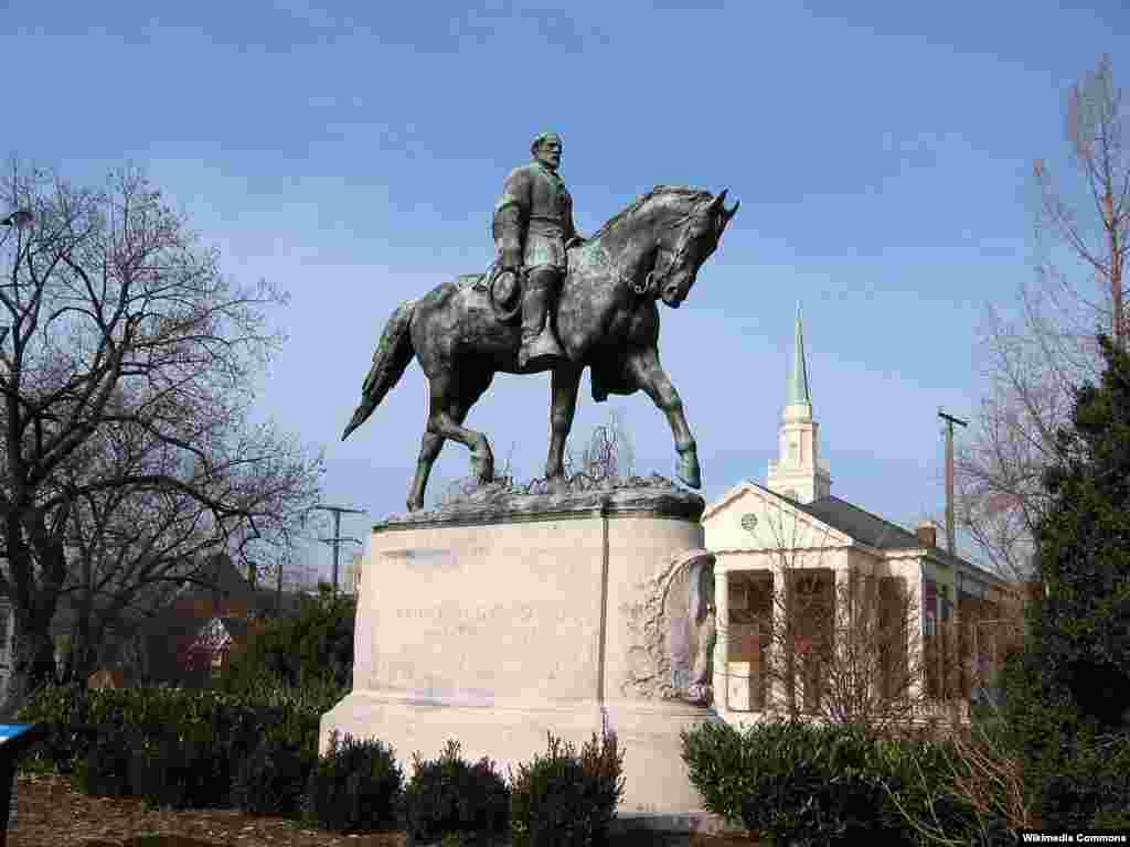 FILE - A statue of Confederate General Robert E. Lee in a Charlottesville, Va., park. 