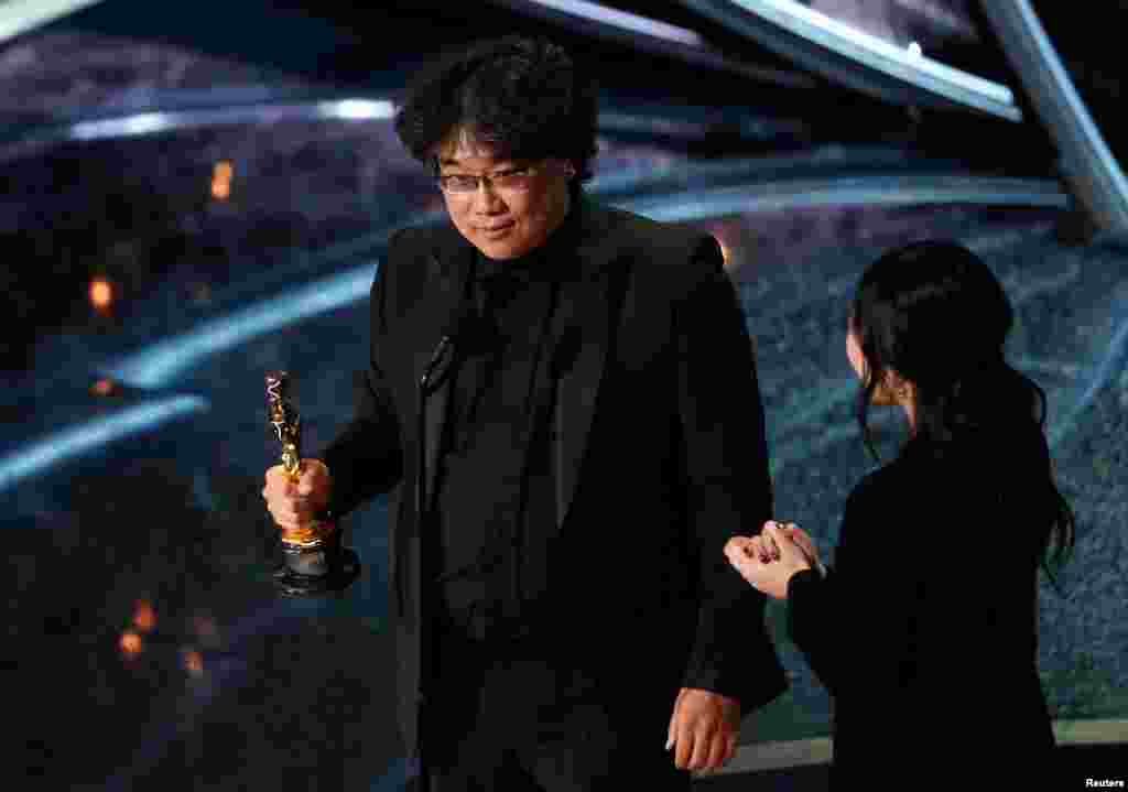 Director Bong Joon-ho accepts the Oscar for Best Foreign Language Film for &quot;Parasite&quot; of South Korea at the 92nd Academy Awards in Los Angeles, Calif., Feb. 9, 2020. 
