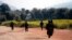 FILE - Myanmar army soldiers patrol a road in Feb. 2015 as part of operations against ethnic rebels in Kokang, northeastern Shan State, Myanmar.