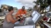 Des survivants du passage de l'ouragan Michael, Mexico Beach, Floride, le 11 octobre 2018