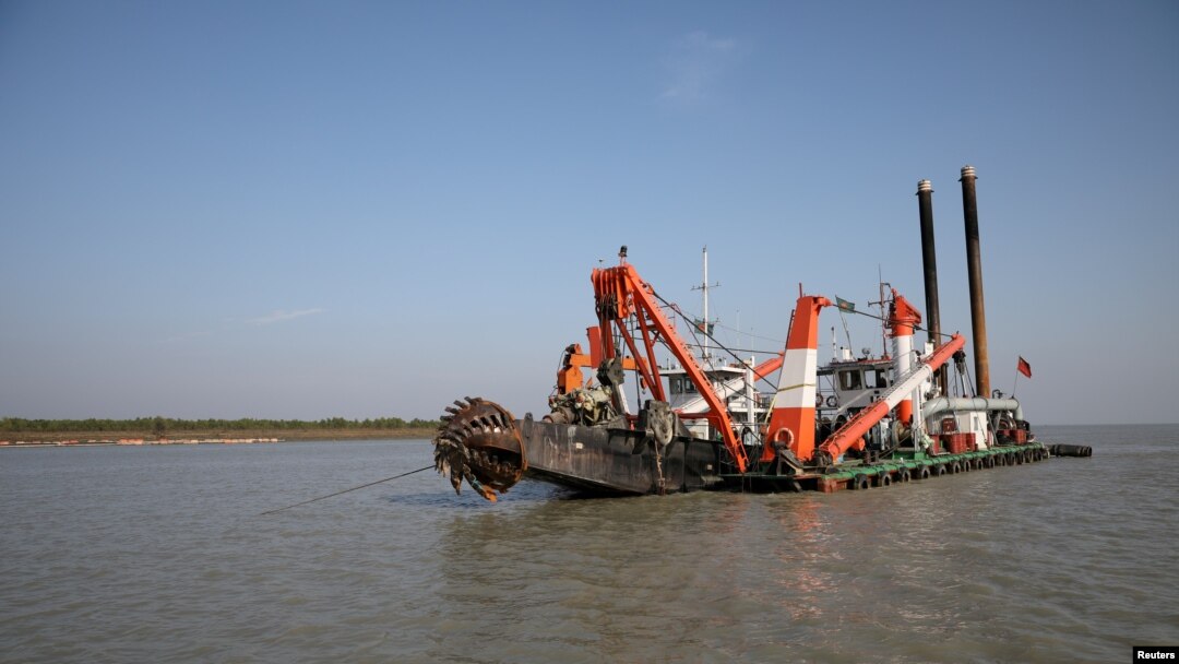 FILE - A dredging machine is seen near the island of Bhasan Char, in the Bay of Bengal, Bangladesh. Feb. 14, 2018. 