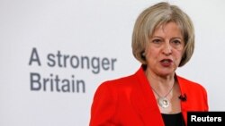 FILE - Britain's Home Secretary Theresa May speaks at a news conference in London, March 23, 2015.