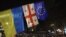 Демонстранти йдуть біля прапорів України, Грузії та Європи під час акції протесту проти рішення уряду відкласти переговори про вступ до ЄС до 2028 року, Тбілісі, 30 листопада 2024 року. Giorgi ARJEVANIDZE/AFP