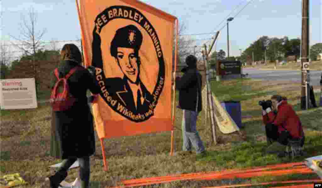 Protestors supporting Pfc. Bradley Manning gather outside Ft. Meade, Md., Friday, Dec. 16, 2011, where Manning will be attending a hearing to determine if he will be court martialed. The U.S. military is making its case for why Manning should be court-mar