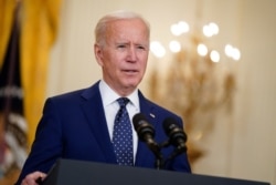 In this April 15, 2021, file photo, President Joe Biden speaks in the East Room of the White House in Washington. No nation offers asylum or other protections to people displaced because of climate change. Biden’s admin is studying the idea.